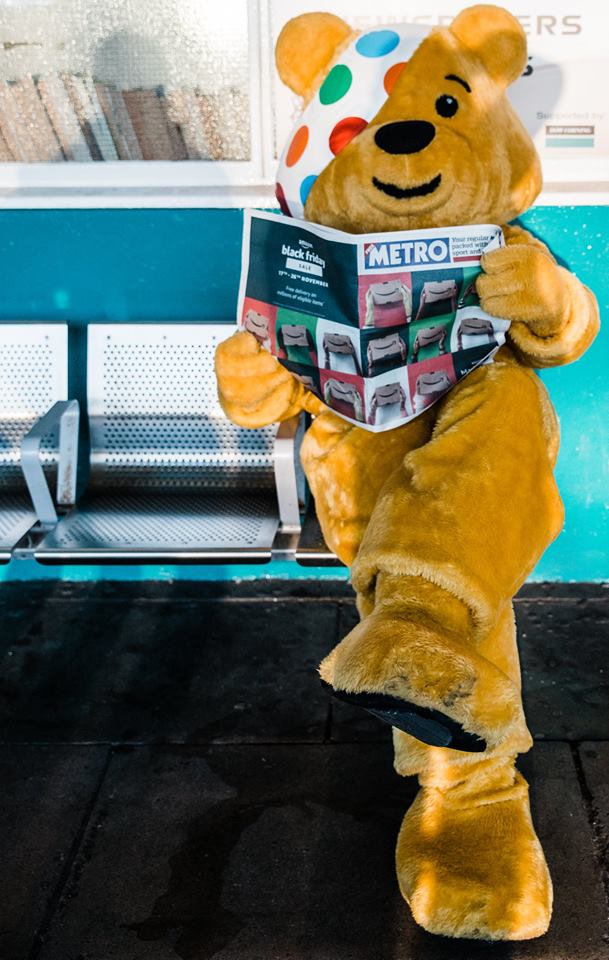 Pudsey Bear reading Metro.