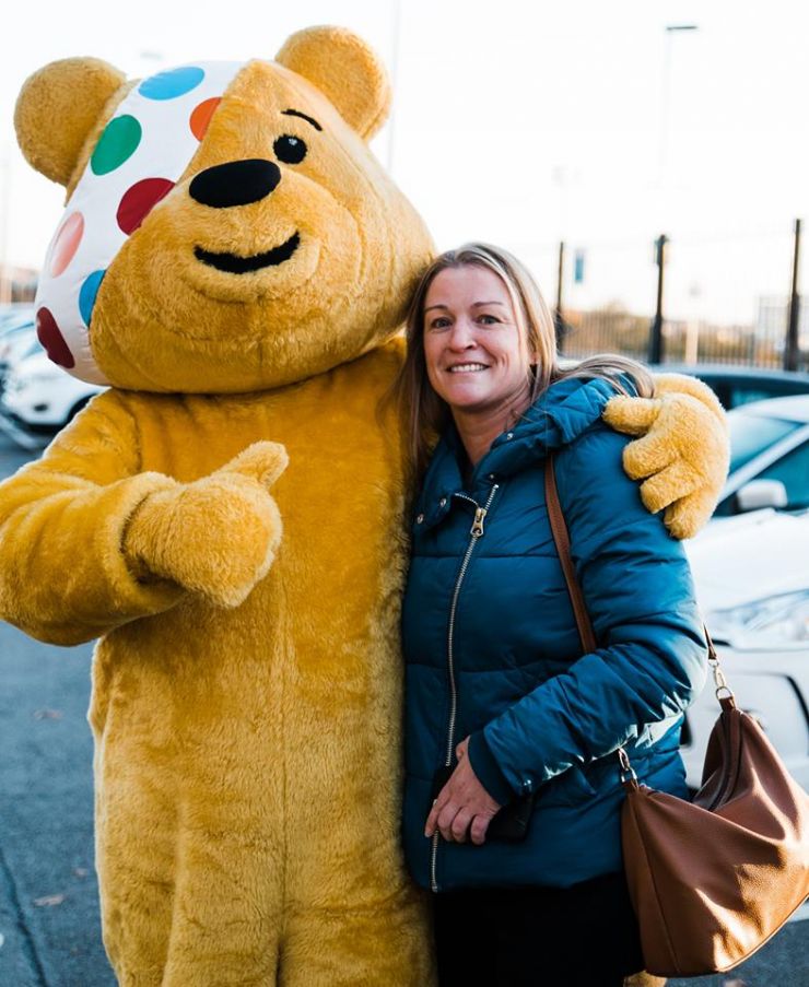 Pudsey Bear and one woman.