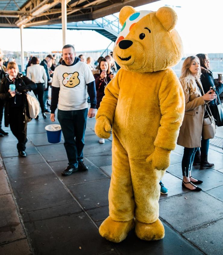 Pudsey Bear with a lot of people.