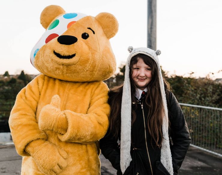 Pudsey Bear with one girl.