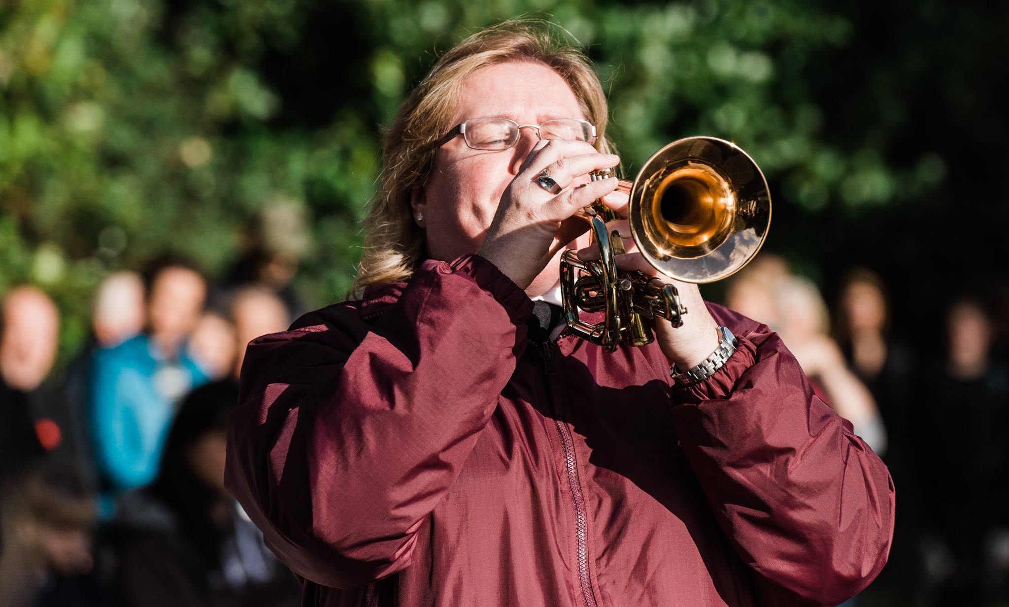 Lady plays saxophone.