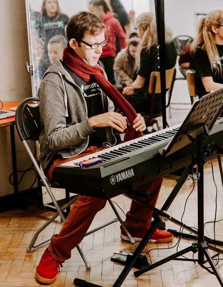 Boy playing piano.