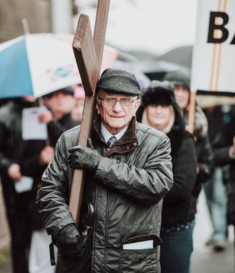 Man carrying the cross.