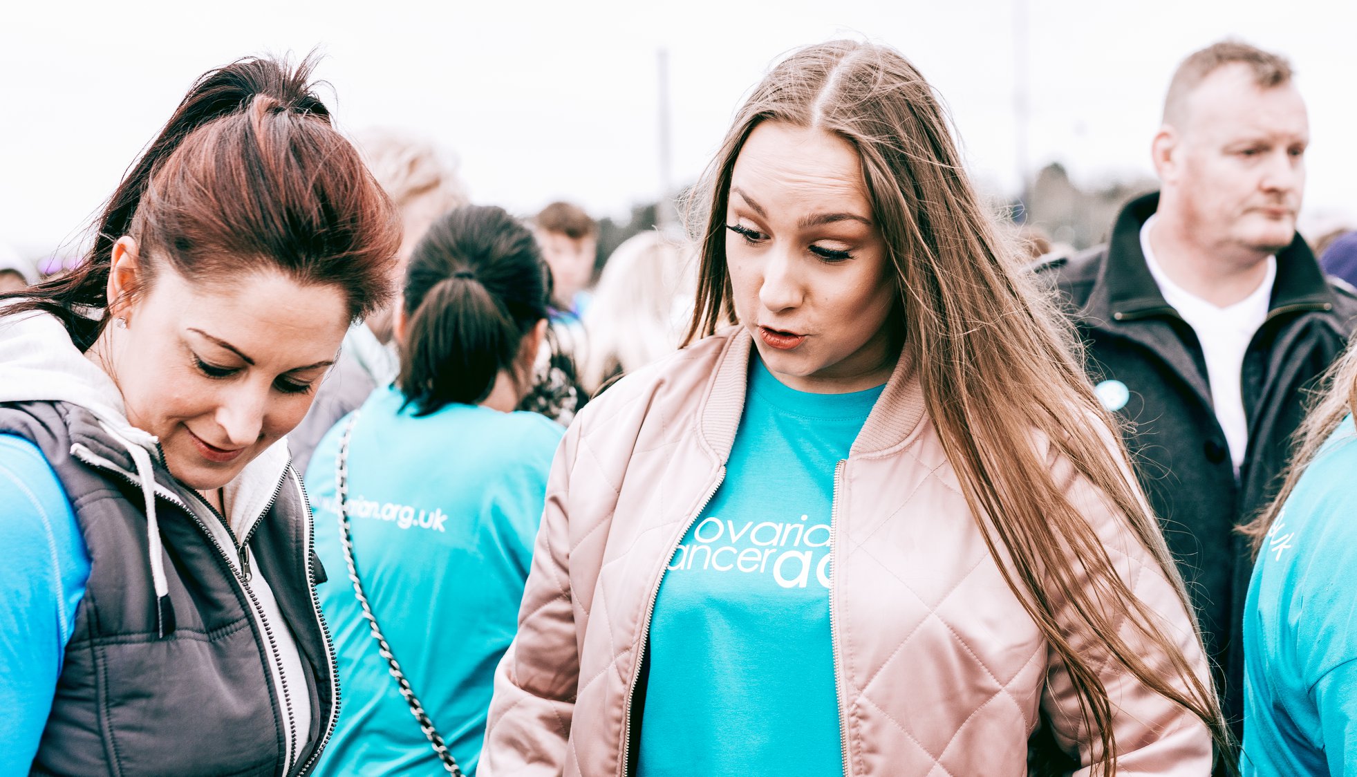 Women's speaking with each other.