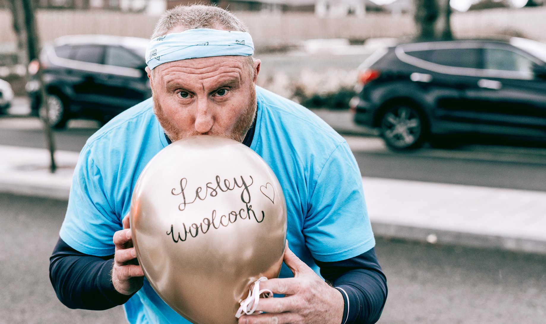 Man kissing a ballon.