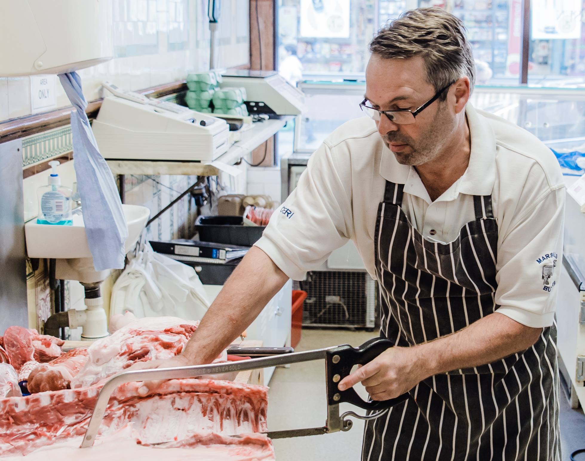 Ceri Williams cutting the meat.