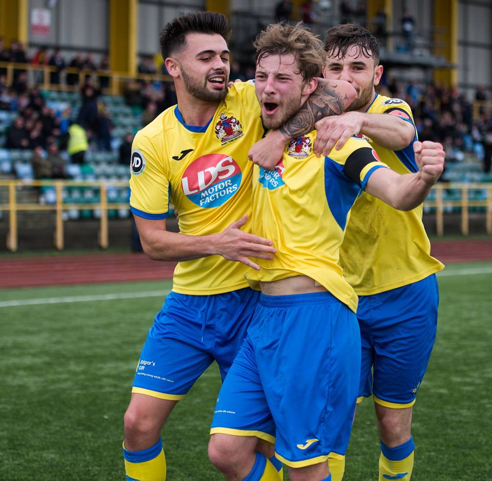 Team celebrates its goal.