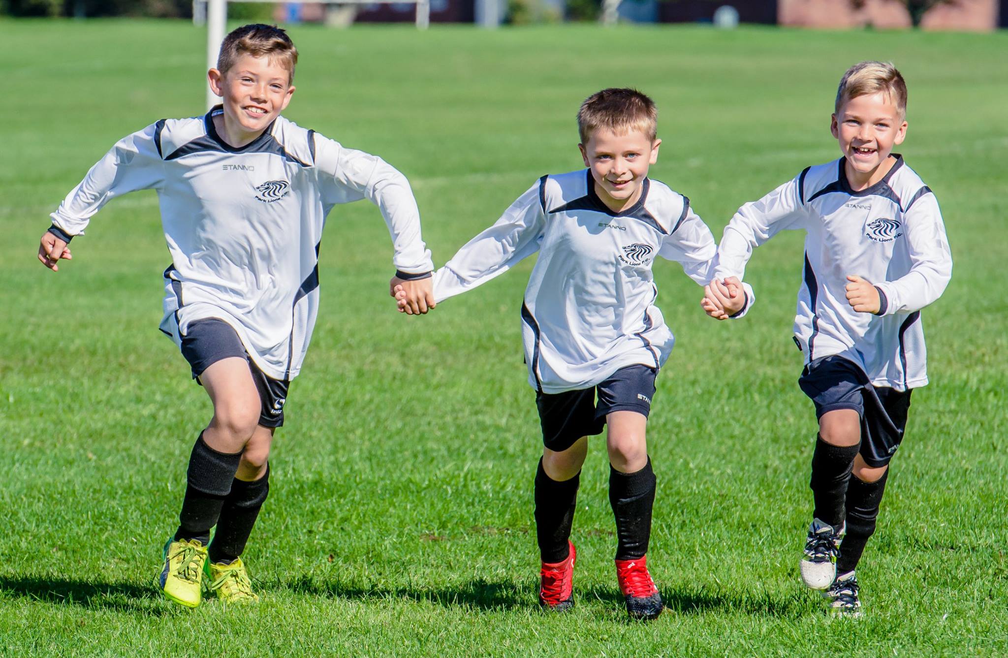 Players running with their hands dads.