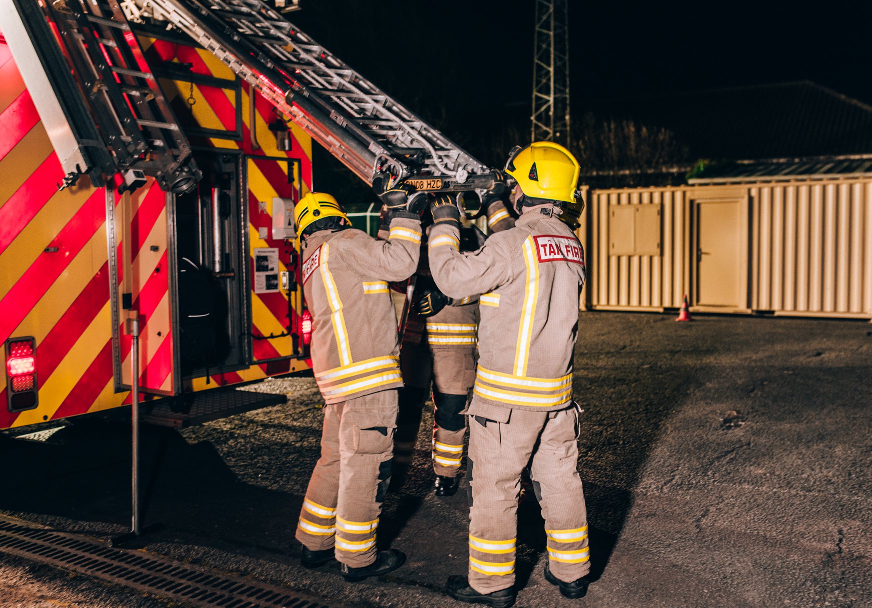 Firefighters tidying up the stairs.