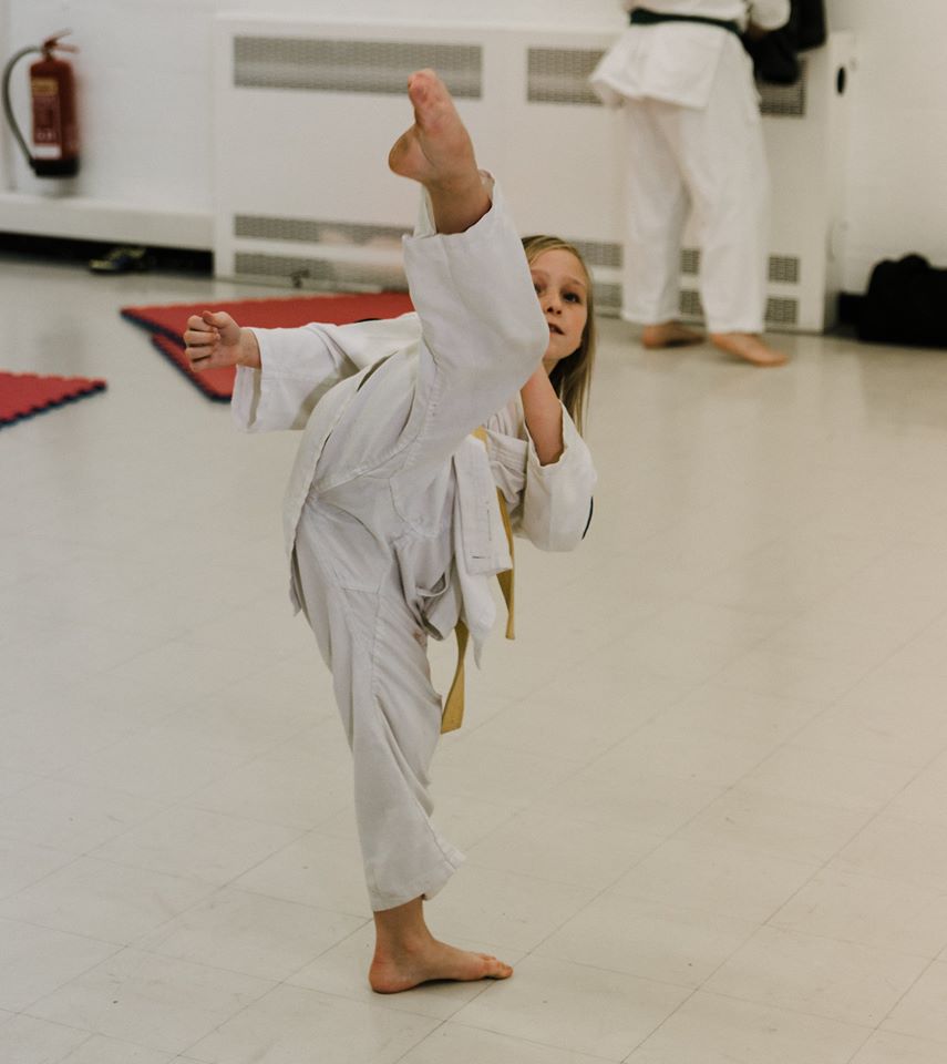 Child giving a kick.