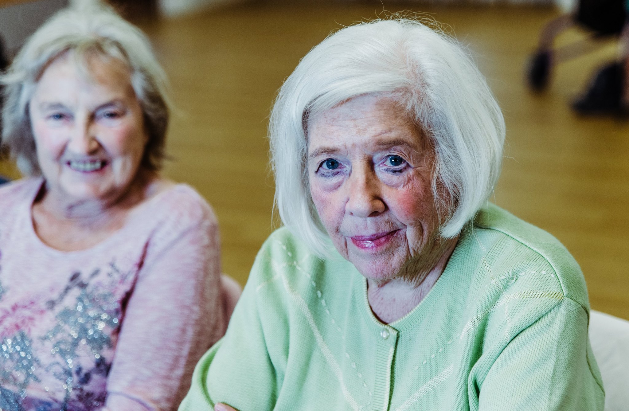 Two ladies making a pose for the photo.