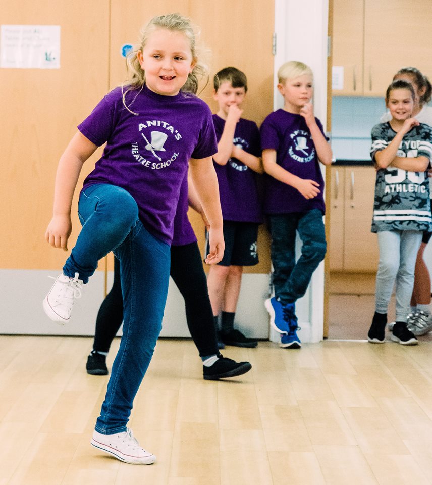 Kid trying to do the dance step.